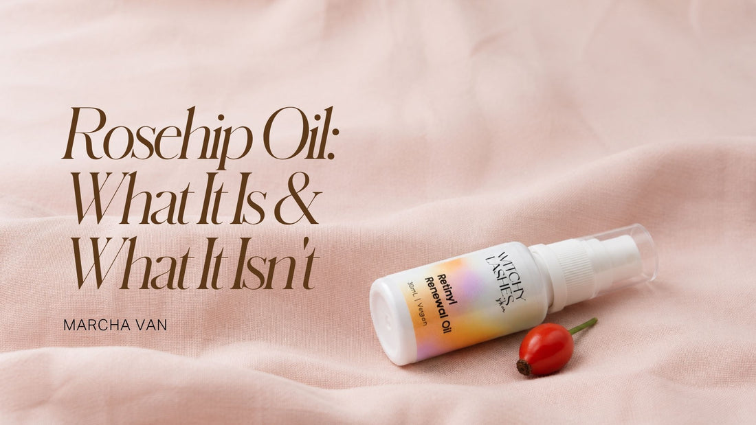 Witchy Lashes Retinyl Renewal Oil bottle resting beside a rosehip berry on pink linen