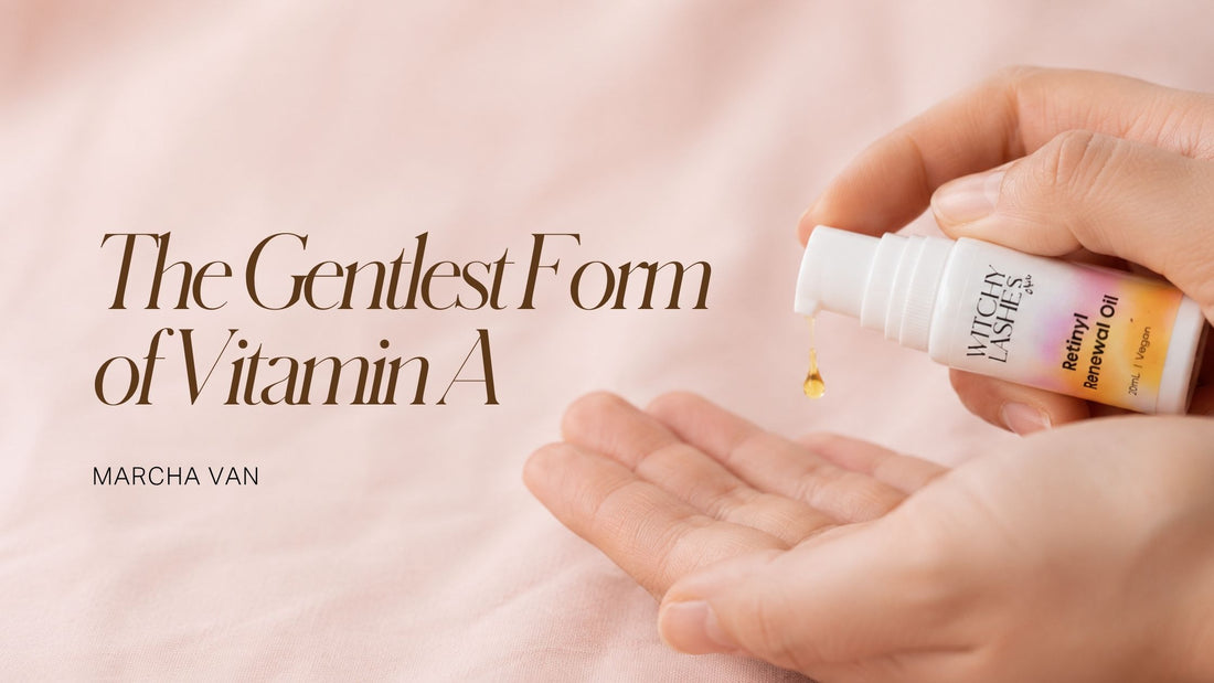 Witchy Lashes Retinyl Renewal Oil bottle dispensing a drop of oil into a cupped hand on pink fabric